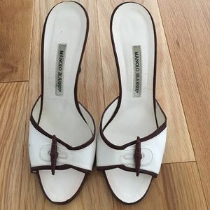 Brown and White Leather Manolo Blahnik slides.